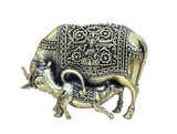 Brass cow with calf statue, front view with detailed engraved paneling
