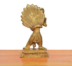 Gold-tone brass Narasimha statue, back view with scale-textured headdress and carved base