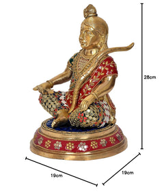 Side view Ram Lalla sitting brass idol with red stole and green-blue ornament work