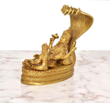 Golden brass Vishnu on coiled serpent, Lakshmi and companions on round base