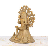 Brass Dakshinamurti Shiva statue, side profile view with draped garment and halo