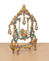 Brass Ganesha playing swing idol close angle, hanging bell chains and decorative frame