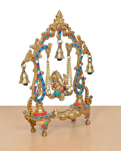 Brass Ganesha playing swing idol close angle, hanging bell chains and decorative frame