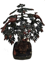 Krishna and Radha swing statue under leafy carved tree with peacocks, round base
