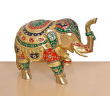 Brass elephant figurine viewed from front-left, decorated trunk and legs in multicolor motifs