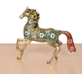 Brass running horse figurine with detailed green saddle, red drape, and studs