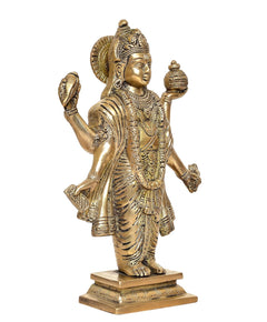 Brass Dhanvantri statue three-quarter view, gold-tone ornaments, ornate draped robe.