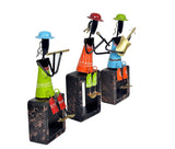Angled view of Iron Musician set: three figurines holding instruments on dark block bases