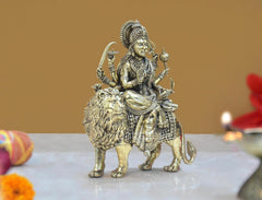 Durga Maa brass idol on lion, three-quarter view, beaded waist and arm ornaments