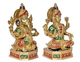 Brass Lakshmi Ganesh statue side view, ornate pedestal base with painted patterns