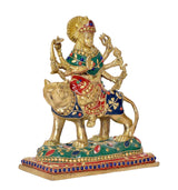 Brass Durga Maa figurine on lion, side view with blue robe and red ornaments