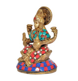 Lakshmi brass figurine, side view with teal necklace and red gem accents
