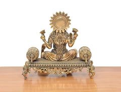 Back view of bronze Lakshmi Maa idol, detailed crown and seated draped posture