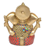 Rear view of brass Ganesha idol with jeweled belly and crown, studded circular pattern