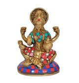 Brass Lakshmi statue with four arms and jeweled blue-red base ornaments