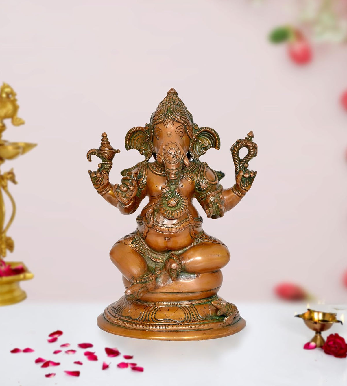 Brass Lord Ganesha idol, seated with four arms and ornate headgear