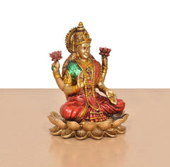 Lakshmi resin idol seated on lotus, jeweled crown, red robe, golden details