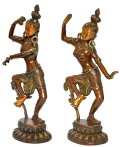 Brass Shiva-Parvati idols in dynamic dance poses, golden faces, decorative arm and torso ornaments