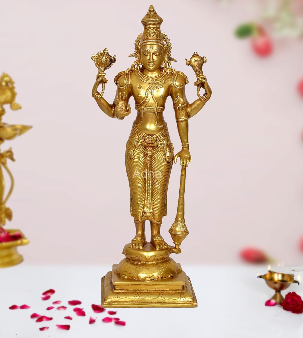 Brass four-armed standing Vishnu statue with ornate crown and detailed jewelry
