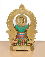 Lakshmi idol back view, gold-tone halo with teal skirt and red beaded trim