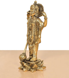 Brass Lord Vishnu idol standing in profile, raised hand holding staff, lotus base