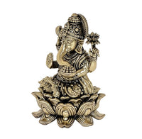 Ganesha brass idol side view with detailed trunk, jewelry, and lotus petals