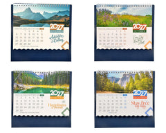 Tabletop nature calendar set showing four 2027 month designs with alpine, lake, and forest scenes