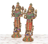 Brass Maa Lakshmi and Vishnu idol pair, close angled view, jeweled crowns and hands