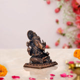 Copper Lord Ganpati murti, rear angle, seated with detailed back headgear