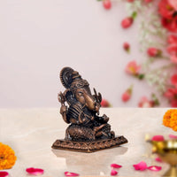 Copper Lord Ganpati murti, rear angle, seated with detailed back headgear
