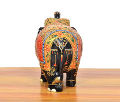 Back view wooden elephant figure, black finish with colorful painted border and emblem