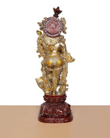 Brass Radha Rani murti back view, halo motif and ornaments, dark red pedestal