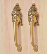 Golden brass long-neck handles with ornate head backplates and curved lever grips