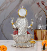 Lakshmi resin statue rear view on lotus, ornate gold halo, seated hands raised