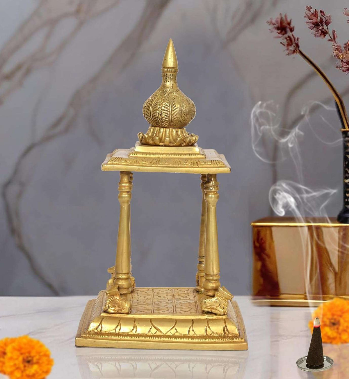 Brass pooja mandir with finial, four pillars and open platform; 13 inch height