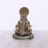 Brass Maa Annapurna murti, back view with engraved design on the head panel