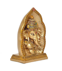 Resin Lord Ganesha idol with halo backplate, gold and jewel accents, angled view