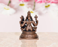 Rear view copper Lakshmi Narasimhar idol, hands raised with decorative back details