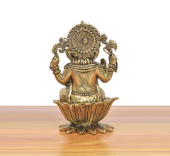 Bronze Lord Ganapati Bappa idol, rear view with circular back ornament and lotus base
