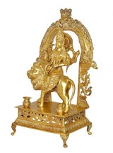 Brass Durga statue idol side view with arched frame and detailed base