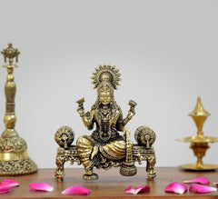 Brass Lakshmi idol on singhasan, 4-inch height, seated with multiple hand gestures