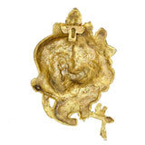 Back of brass Krishna mask wall hanging with textured finish and hanging openings