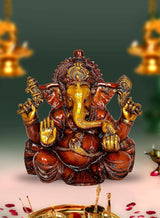 Ganesha idol seated on lotus, red-brown with gold detailing, front view