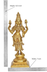 Brass Lakshmi idol with height label 12.5 in, ornate crown, four arms, pedestal base.