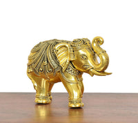 Golden brass elephant decor figurine, front-right view with trunk curled upward