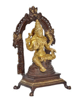 Brass Lakshmi idol statue, golden figure with ornate arch and dark pedestal base
