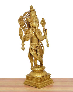 Krishna brass figure playing flute, gold finish, three-quarter view with detailed arms