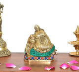Brass Radha Krishna statue, rear angle; teal skirt band and multicolor bead belt
