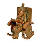 Brass Ganesha on chair, side view, seated and reading, detailed turban