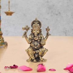 Superfine Brass Lord Ganesha idol, seated with four arms and ornate crown.